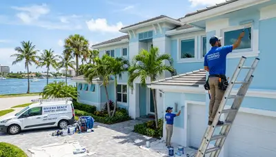 Professional house painters in West Palm Beach FL refreshing home exterior with premium paint finish